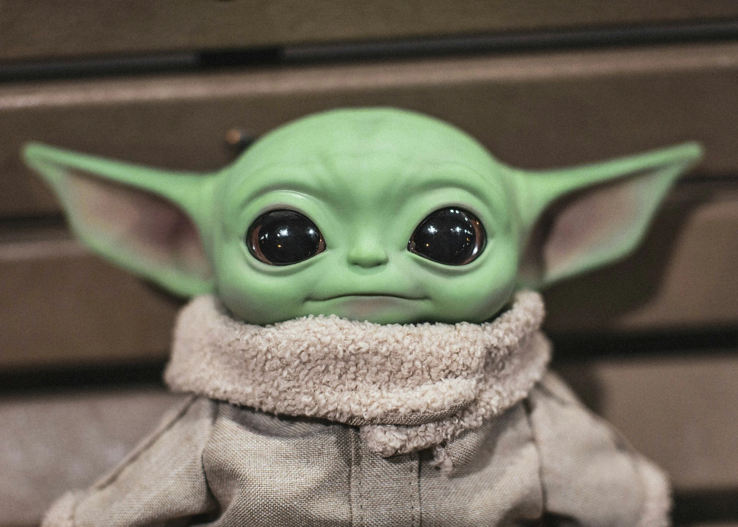 Close-up of a Grogu doll from The Mandalorian.